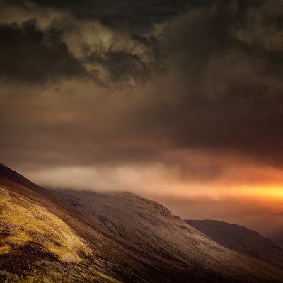 Sun Peaking Behind Mountains